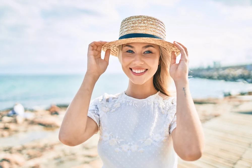 Model in her 30s enjoying some sunshine by the water